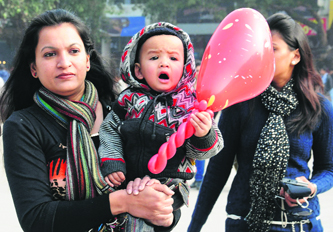 Residents enjoy a cold Monday afternoon at Sector 17 in Chandigarh.