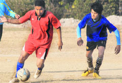 Players in action during a match in the 7th Abhishek Dabral Memorial Football Tournament in Dehradun on Monday. 