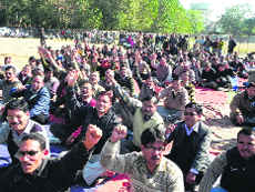 Striking ministerial employees hold a demonstration in support of their demands in Dehradun on Monday.