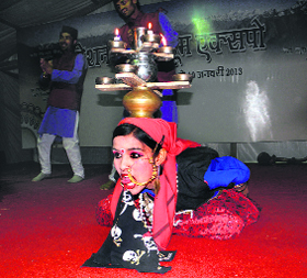 A Jaunsari dancer performs during a cultural event at the National Handloom Expo being held at Parade Ground in Dehradun on Monday.