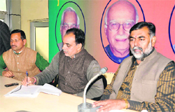 Prahlad Patel, national president of the Bharatiya Mazdoor Mahasangh, addresses a press conference in Dehradun.
