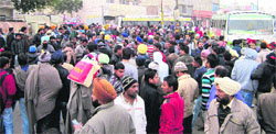 Traffic comes to a halt at Ambedkar Chowk following a row between bus conductors near Ropar bus stand on Monday. A Tribune photograph