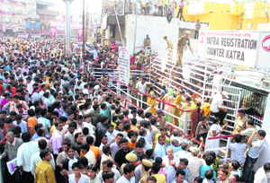 A heavy rush of pilgrims outside the yatri registration counter in Katra on Monday.