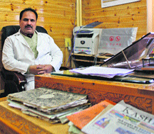 Dr Mushtaq Ahmad at his office after conducting a surgery on the HIV positive woman in Srinagar. 