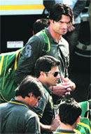 Mohammad Irfan and other Pakistan cricketers on their arrival at the airport in Kolkata on Monday; Shoaib Malik (top).  PTI 
