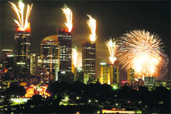 Ushering in 2013: Fireworks explode on the rooftops of buildings in Sydney during the New Year celebrations.  Reuters