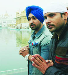 Amrinder Gill and Diljit Dosanjh pay obeisance at the Golden Temple in Amritsar on Tuesday. 