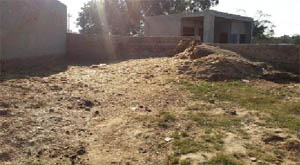 The site in village Deep Singh Wala where a park was shown to be existing on paper. In reality, the place is being used to store wheat husk. 