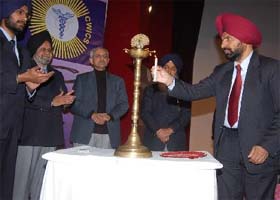 The ceremonial lamp being lighted at the inauguration of the state-level conference of CWICS at Adesh University in Bathinda on Tuesday