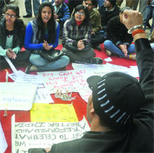 People stage a sit-in at Jantar Mantar, demanding justice for the gangrape victim, in New Delhi on Tuesday.