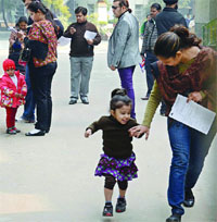 Parents, along with their children, arrive at Salwan Public School in Rajender Nagar to collect nursery admission forms. 