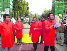 Members of the Indian Peoples Theatre Association stage a street play to commemorate the sacrifice of famous theatre artiste Safdar Hashmi at Gandhi Park in Dehradun on Tuesday.