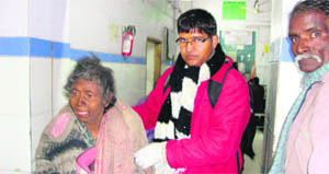 An elderly woman, who was found near Jain Dharmshala, being brought to Doon Hospital by volunteers of HelpAge in Dehradun on Tuesday. 
