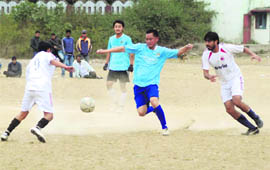 Players in action during a match in the 7th Abhishek Dabral Memorial Football Tournament in Dehradun on Tuesday. 