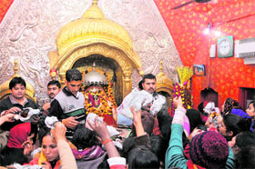 Devotees pay obeisance at Goddess Kali Devi Temple on the first day of the new year in Jammu on Tuesday.