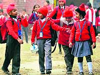 Students come out a school in Ludhiana on Tuesday