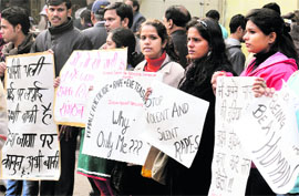 Protesters make a human chain demanding justice for the gang rape victim at Jantar Mantar in New Delhi on Tuesday.