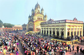 Devotees stand in queues to offer prayers at Dakshineswar Temple on the occasion of 'Kalpataru festival', which is celebrated on New Year day, in Kolkata, West Bengal, on Tuesday.