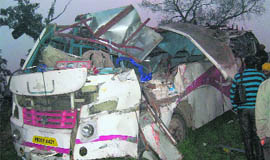 The mangled remains of a bus that hit a tree at Karrail village in Sangrur district on Tuesday.