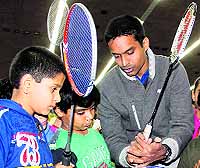 National badminton coach Pullela Gopichand interacts with young players at Panjab University in Chandigarh on Wednesday