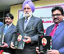Dr Dilbagh Singh Hira (centre) DG,SVGOI, unveils the group's journal during a press conference on Wednesday