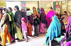 Patients wait for their turn at the dispensary in Ramdarbar, Chandigarh. There was only one doctor to attend to over 100 patients