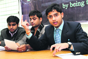 Members of Making A Difference, a youth organisation, address a press conference in Dehradun on Wednesday.