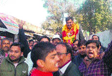 Sanjay Rattan, MLA, Jawalamukhi, being taken in a procession by Congress workers at Dehra on Wednesday. 