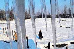 Icicles hang from the roof of a residential house at Damhal Hanjipora in Anantnag district on Wedneday