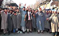 Residents of Yashipora village shout slogans against the state government and the Power Development Department in the wake of shortage of electricity in Anantnag district on Wednesday
