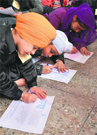 Children participate in a drawing competition during the Youth Inspirational Programme of Guru Gobind Singh Study Circle.