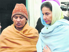 Union Minister Preneet Kaur with victims mother at Badshapur village in Patiala on Wednesday. Tribune photo:Rajesh Sachar 