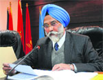 Jasminder Singh, Additional DGP, Crime, at a press conference in Chandigarh on Wednesday. Tribune photo: S Chandan