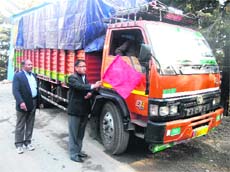 MC president OP Uniyal flags off the first truck laden with plastic garbage for recycling, in Mussoorie on Thursday.