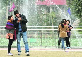 Girls and boys share a pleasant time on a cold morning in Karnal.
