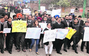 Members of the District Bar Association take out a protest march in support of the Delhi gang-rape victim in Jalandhar on Thursday. 