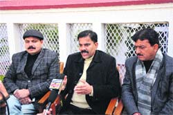 Jammu and Kashmir National Panthers Party leader Harsh Dev Singh (centre) addresses a press conference in Jammu on Thursday.