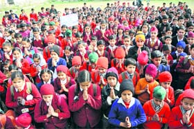 School students pray during a protest in Bhou Camp area of Jammu on Thursday. They demand appropriate action in the wake of a gang rape in Delhi.