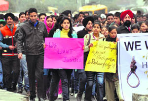 College students hold a protest march in Ludhiana on Thursday.