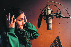 Soosan Feroz, Afghanistans first female rap musician, prepares for a recording session in Kabul.