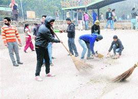 The NSS unit carries out a cleanliness drive on the PU campus in Chandigarh on Friday. 