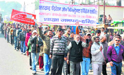 Members of the ministerial employees association take out a march regarding pay anomalies in Haridwar on Friday. Tribune photo:Rameshwar Gaur