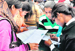 Girls fill forms for admission to graduate courses as private students at Shravan Nath Jawaharlal Nehru College in Haridwar on Friday. Tribune photo: Rameshwar Gaur