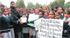 Schoolgirls hand over a memorandum to SDM Baljit Singh at Fatehabad on Friday in protest against the rise in crime against women. 