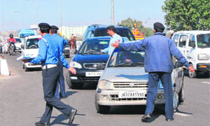 Traffic police personnel check violations of traffic norms in Jammu. 