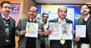 Officials of the Life Insurance Corporation of India (LIC) launch new products in Jammu on Friday. 