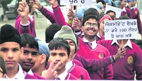 Students take part in a rally organised by the traffic police in Jalandhar on Friday.