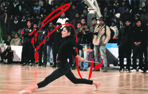 Panache: A gymnast performs during the closing ceremony of the National Basketball Championship in Ludhiana on Friday.