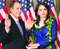 Tulsi Gabbard being administered the oath of office by Speaker of the US House of Representatives John Boehner in Washington on Friday.  Reuters 