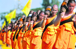 Buddhist monks participate in a procession to mark the 2,600th anniversary of the enlightenment of Lord Buddha on the outskirts of Bangkok on Friday.  Reuters